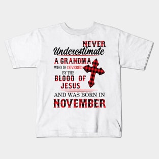 Never Underestimate A Grandma Blood Of Jesus November Kids T-Shirt